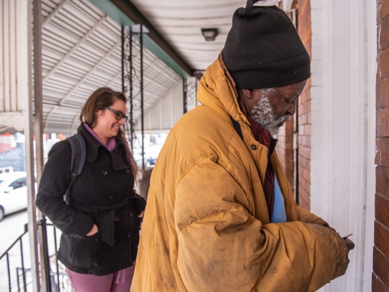 Pathways participant opening door to his home