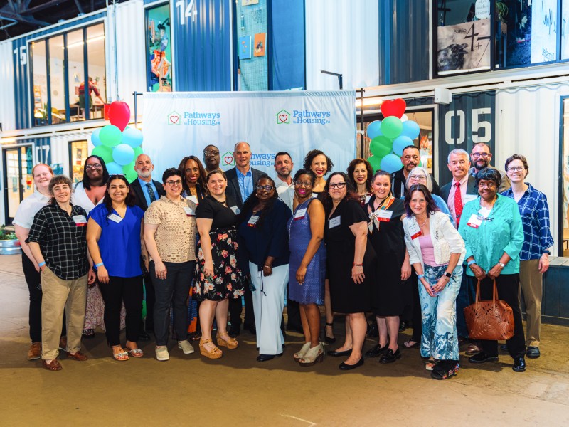 group photo of staff and board members at furnished for good event