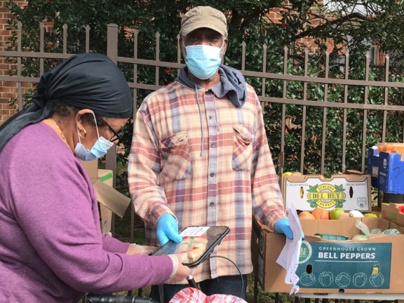 man hands out food