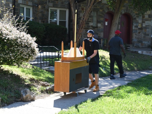 person moving furniture