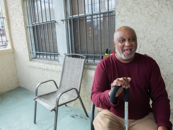 Photo taken before pandemic man smiling on porch