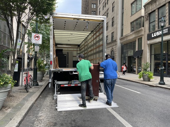 two men loading a truck