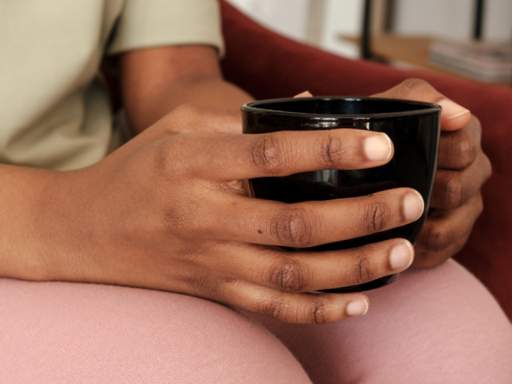 person holding a mug