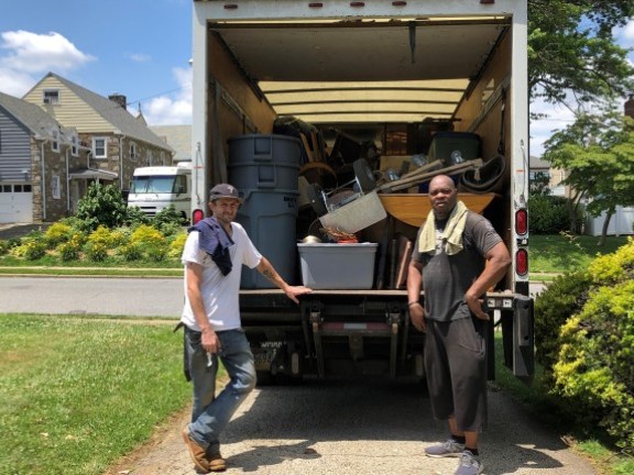 two men loading a truck