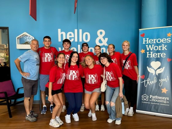 group of volunteers from a local college at the furniture bank