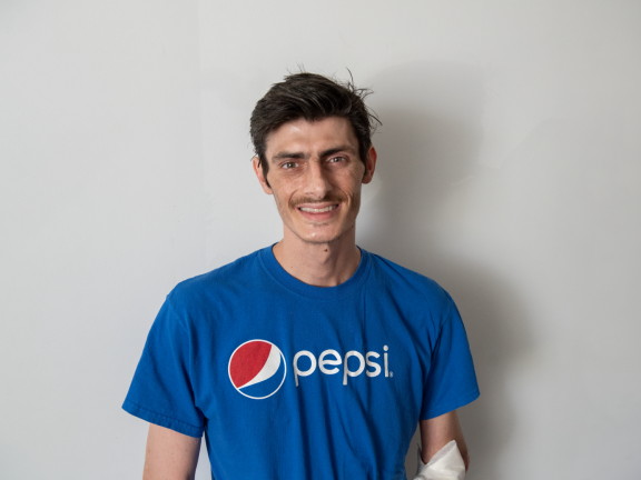 participant james smiling at camera