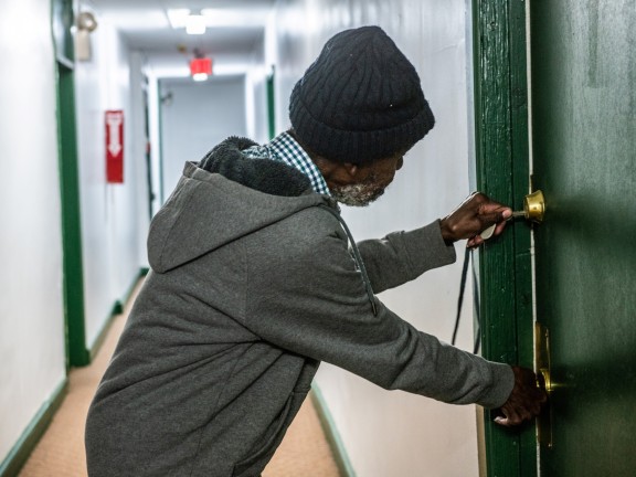 participant opening door to their apartment
