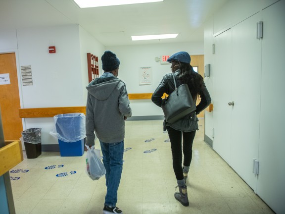 Two people walking away from the camera