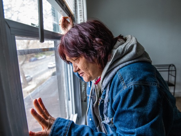 Woman looking out window