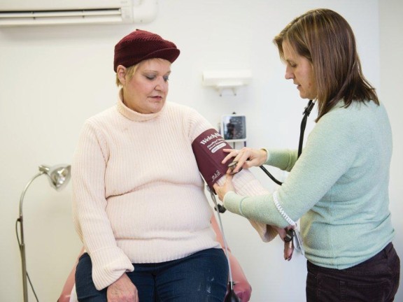 Participant getting blood pressure done by the nurse