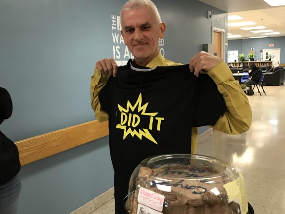 Michael with his "I did it!" shirt and a cake.