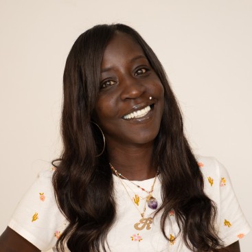 Renee Frink-Boyd, Training Specialist smiling in front of white background