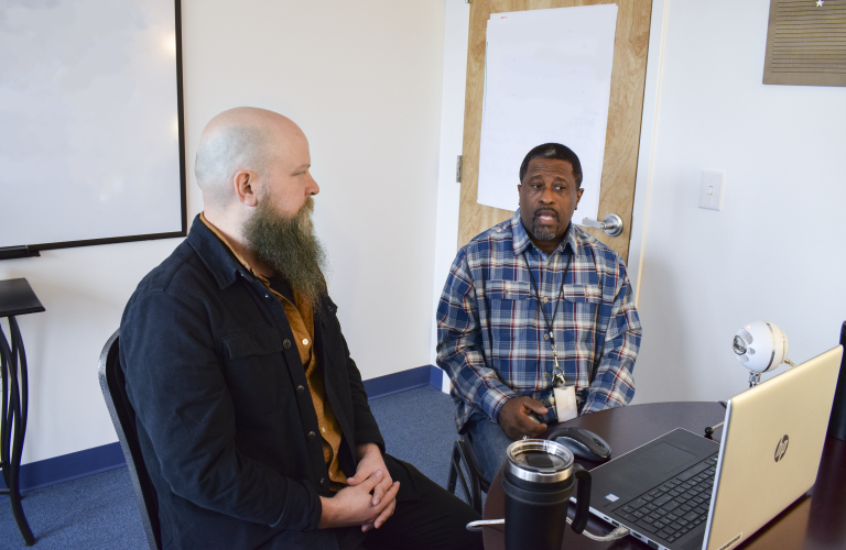 men hosting a webinar