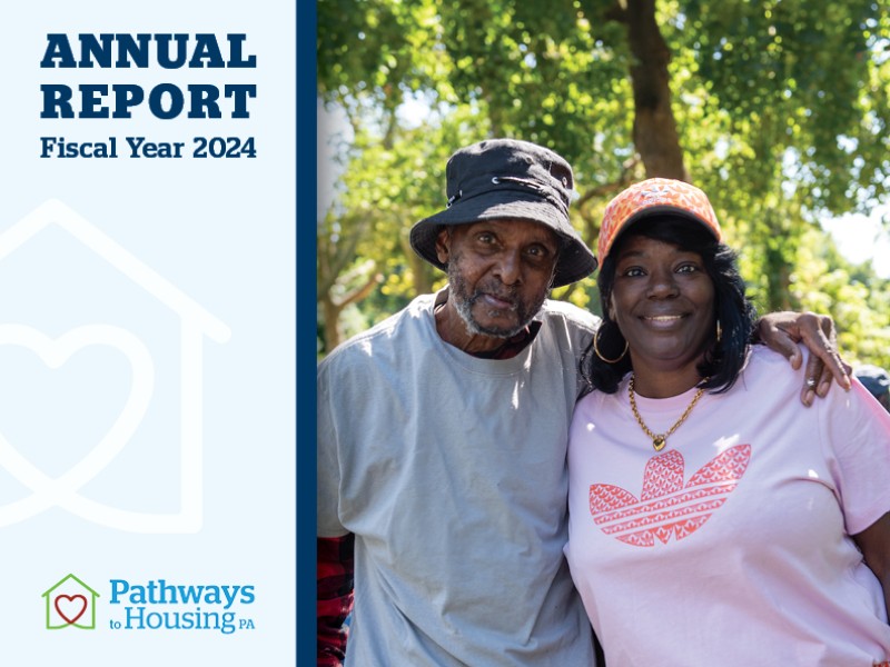 cover of the annual report with two participants outdoors on the cover