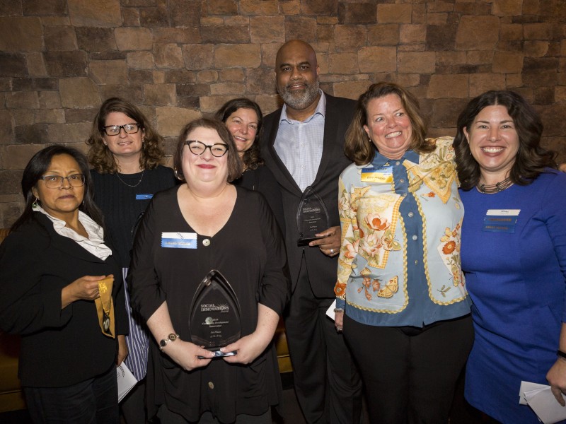 staff members standing together smiling