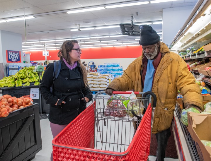 case manager and program participant grocery shopping
