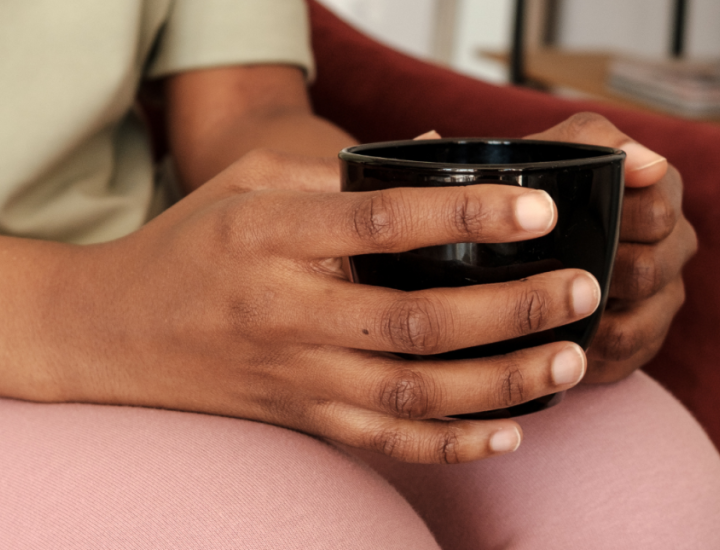 person holding a mug