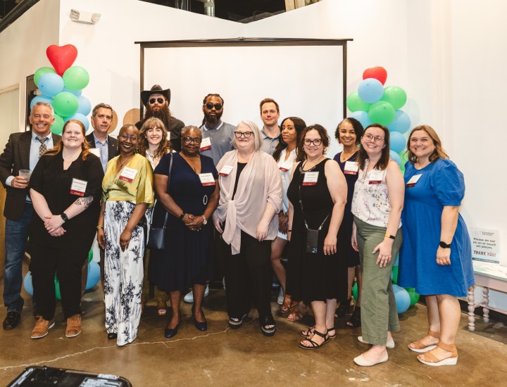 group photo of staff and board members at furnished for good event