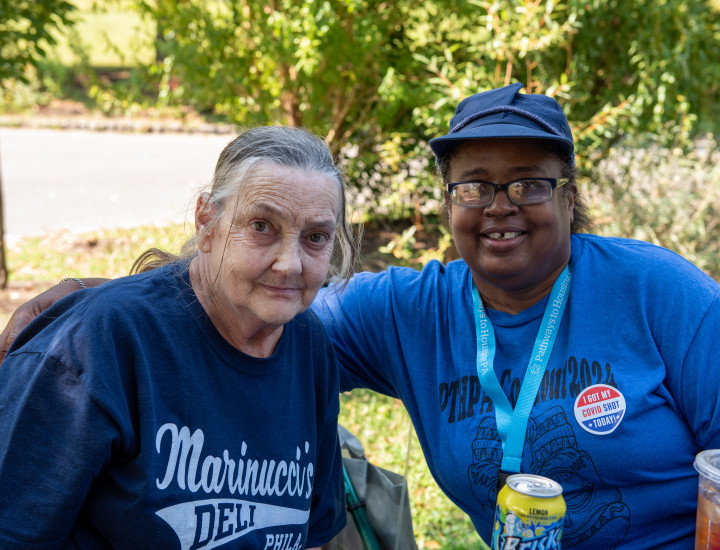 Debbie on the left taking a photo with Angie, a Pathways staff member