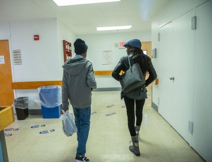 Two people walking away from the camera